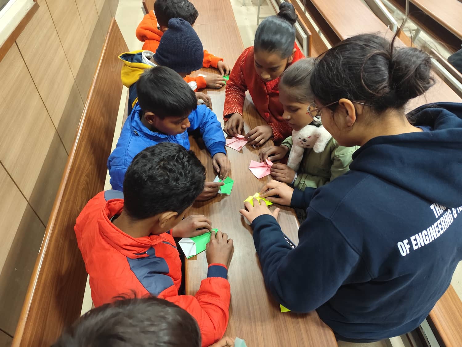 Triman working with children during a hands-on activity